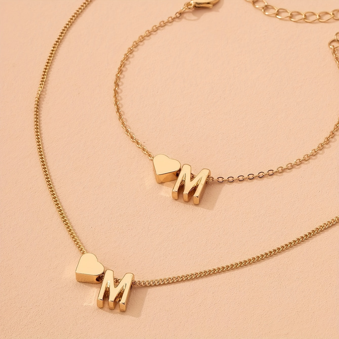 A Stylish And Minimalist Two-Piece Set Featuring a Metal Heart And English Letter Necklace And Bracelet, Perfect for Everyday Commuting Wear.